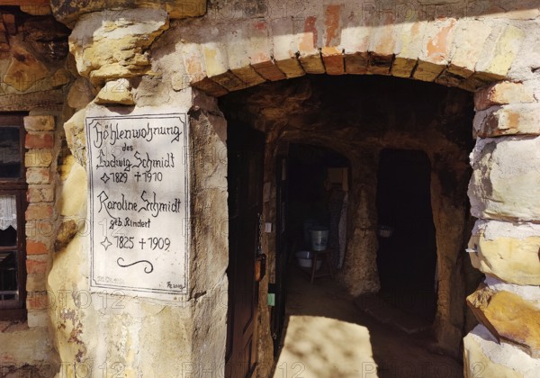 Sign at the entrance to the Schmidthöhle cave, Langenstein cave dwellings, district of Halberstadt, Harz district, Saxony-Anhalt, Germany, Europe