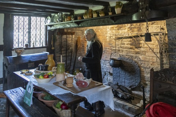 Interior view, kitchen, fireplace, table, food, museum guide, Anne Hathaway's Cottage, Shottery, Stratford-upon-Avon, Warwickshire, England, Great Britain