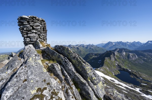 Cairn at the summit of Rundfjellet, view of mountains and fjord landscape, Svolvaer, Nordland, Norway, Europe