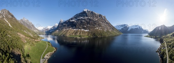 Panorama aerial view of fjord Hjørundfjord, from village Øye (left) to Urke (right), Mt. Stalbergneset (middle), Norway, Europe