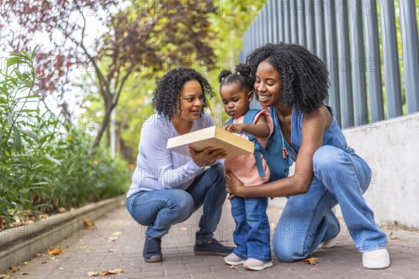 African female family of two generations having fun at the end of a school day
