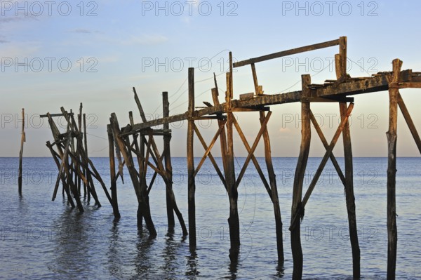 Remains of wooden walkway of traditional carrelet fishing hut on the beach, Loire-Atlantique, France, Europe