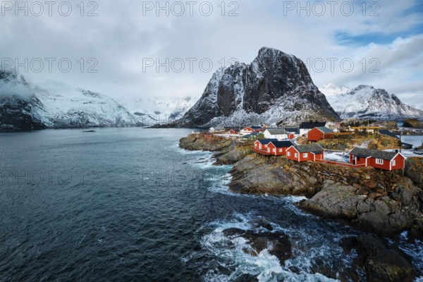 Hamnoy fishing village with red rorbu houses in Norwegian fjord in winter. Lofoten Islands, Norway, Europe