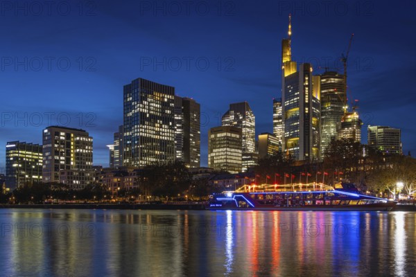 The Kansas City Chiefs' NFL boat is anchored on the River Main in front of Frankfurt's banking skyline. On Sunday, 5 November 2023, the Chiefs' football team led by quarterback Patrick Mahomes will face the Miami Dolphins in Frankfurt's Waldstadion, Mainufer, Frankfurt am Main, Hesse, Germany, Europe