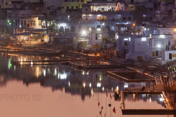 PUSHKAR, INDIA, NOVEMBER 21, 2012: Sacred Puskhar Sagar lake and ghats of Pushkar in twilight in the evening. Pushkar is one of oldest existing cities of India & important pilgrimage site for Hindus