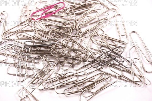 Detail of paper clips on a white background, copy and paste space