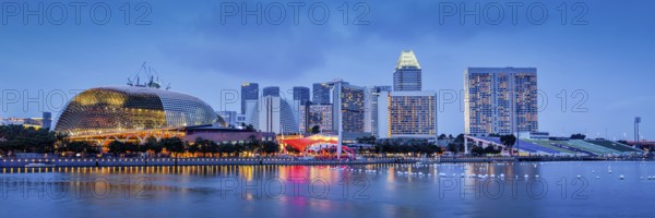 Panorama of Singapore skyline at Marina Bay in the evening
