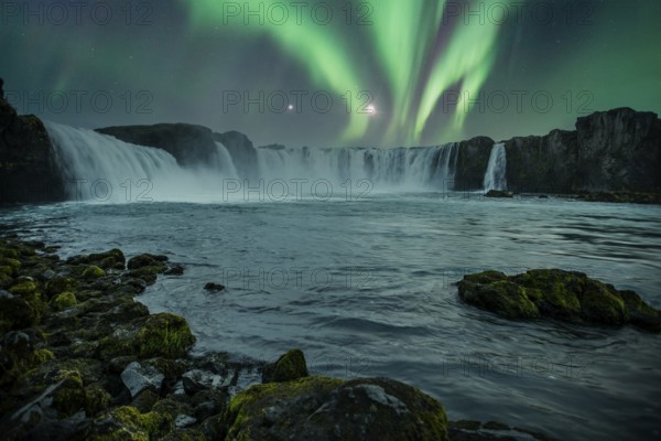 Godafoss waterfall on a night with a beautiful Northern Lights. Iceland
