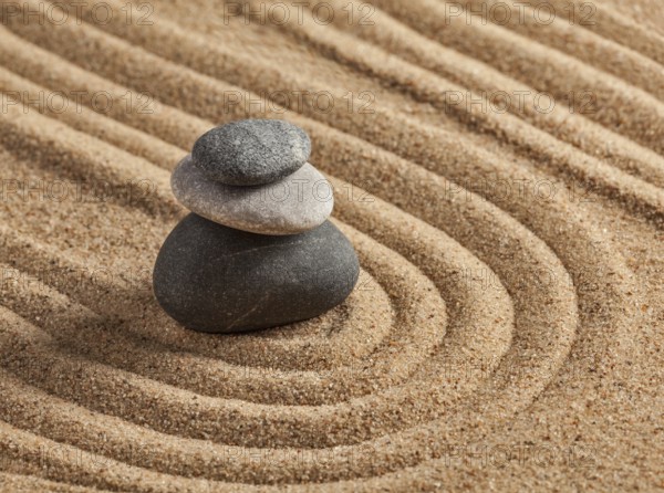 Japanese Zen stone garden, relaxation, meditation, simplicity and balance concept, pebbles and raked sand tranquil calm scene