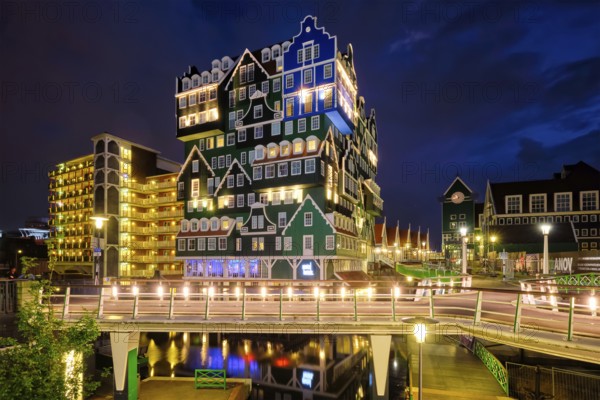ZAANDAM, NETHERLANDS, MAY 21, 2018: Inntel Hotel in Zaandam illuminated at night. Design of 12-storey tall building opened in 2009 is the result of stacking a series of traditional Dutch houses