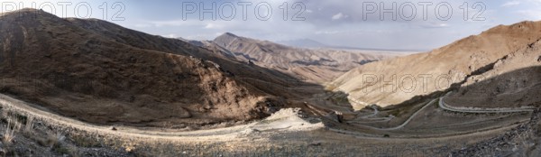 Panorama, view of mountain landscape and pass road at Tyibel Pass, Song Kul Too mountain range, Naryn region, Kyrgyzstan, Asia