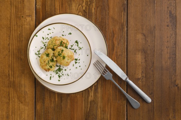 Top view of veal cutlets baked in oven on a plate