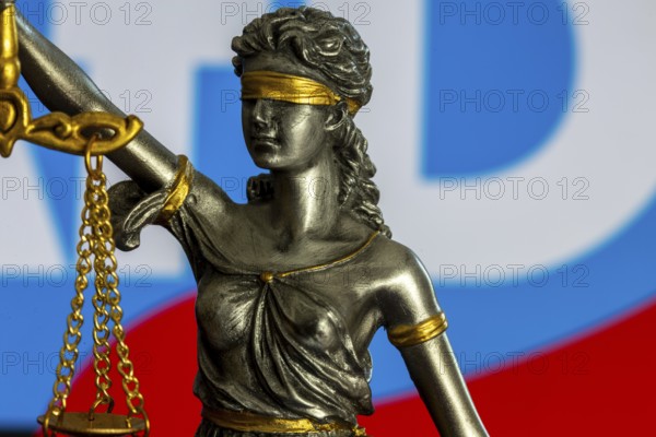 Justitia in front of the AfD logo (symbolic image) . The Office for the Protection of the Constitution has categorised the AfD as right-wing extremist. The AfD wants to take legal action against this