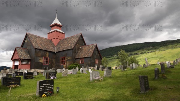Cemetery under a gloomy sky, Dovre church, Dovre kyrkje, Dovre, Fylke Innlandet, upper Gudbrandsdalen valley, Norway, Europe