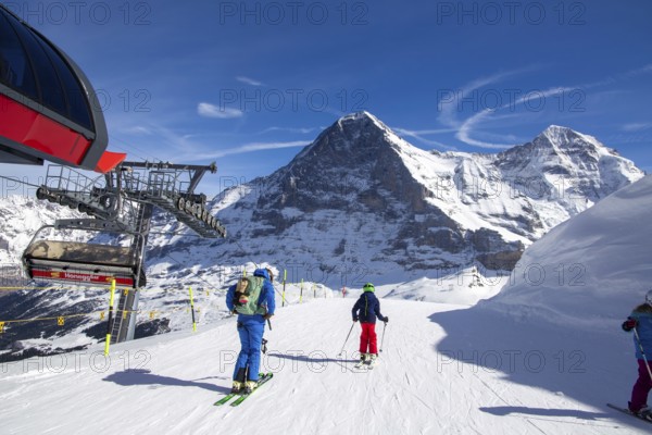 25 March 2024: Skiing against the backdrop of the north face of the Eiger in Grindelwald, Switzerland, Europe