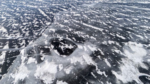 Frozen lake in early winter. Region of La Mauricie. Province of Quebec. Canada