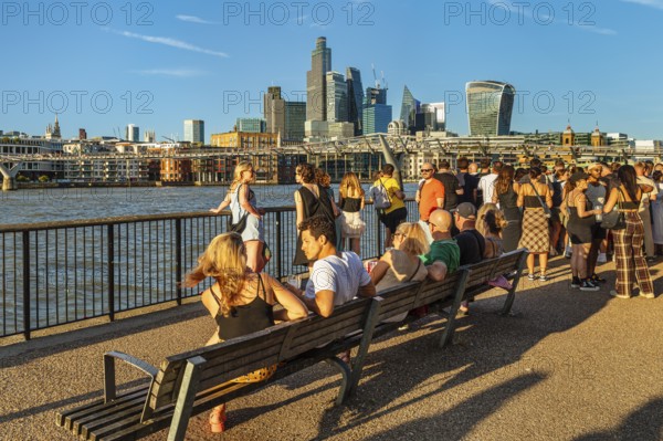 People enjoying the summer evening on the Thames near the Millenium Bridge, London, England, Great Britain, London, South England, United Kingdom, Europe