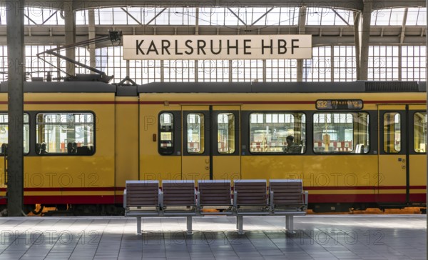 Karlsruhe main station, platform with station sign. Tram in the Karlsruhe public transport network (KVV) . Karlsruhe, Baden-Württemberg, Germany, Europe