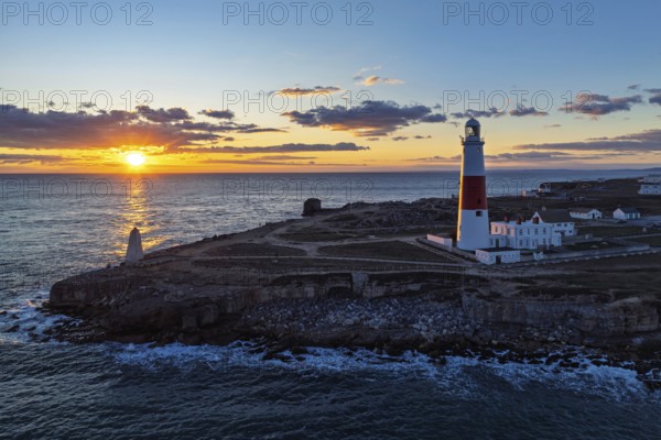 Sunset over Portland Bill Lighthouse from a drone, Portland Bill, Isle of Portland, Dorset, England, United Kingdom, Europe