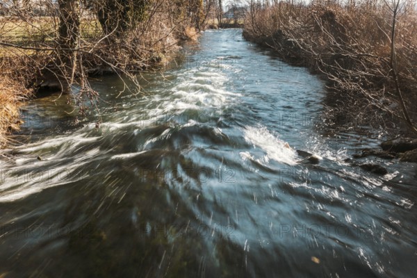 A clear river flows through a landscape lined with trees and bushes, Kehrbach, Neunkirchen, Lower Austria, Austria, Europe