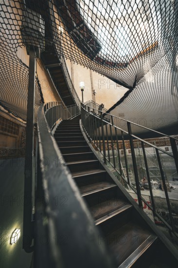 Architectural view of a wooden staircase under a net at a lofty height, old Elbe tunnel, Hamburg, Germany, Europe