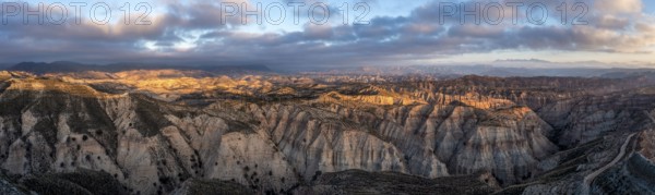 Sunrise, wide hilly desert landscape with dry vegetation, Gorafe desert, semi-desert, Granada, Andalusia, Spain, Europe