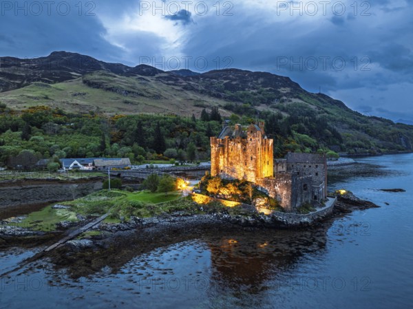Night over Eilean Donan Castle and Loch Duich from a drone, Isle of Skye, Highlands, Scotland, England, United Kingdom, Europe