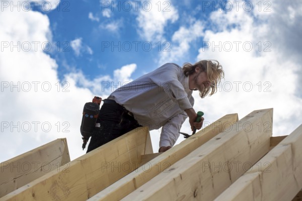 Carpenters working on the roof of a new building in the Rhein-Pfalz district