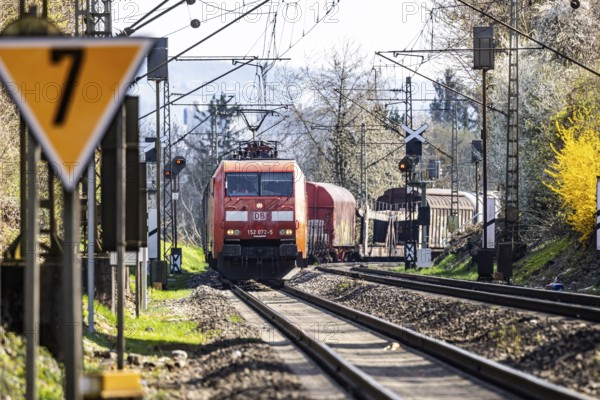 Goods train with a Deutsche Bahn AG locomotive travelling on the open track. Stuttgart, Baden-Württemberg, Germany, Europe