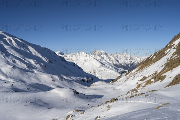 Mountain panorama with the peaks of the Bergüner Stöcke Tinzenhorn and Piz Ela, mountain landscape with snow in the morning light, view at the Keschhütte in winter, Bündner Haute Route, Albula Alps, Rhaetian Alps, Grisons, Eastern Switzerland, Switzerland, Europe