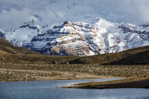 Himalayas mountains and mountain lake Dhankar Lake. Spiti Valley, Himachal Pradesh, India, Asia