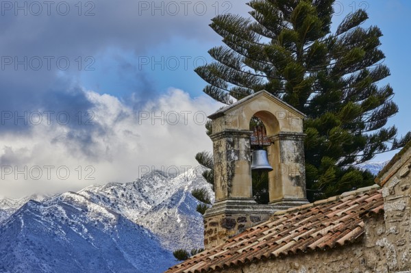 Bell tower, church, snow-capped mountains, tall tree, cloudy sky, Myriokephala, Orthodox Monastery, Crete, Greece, Europe