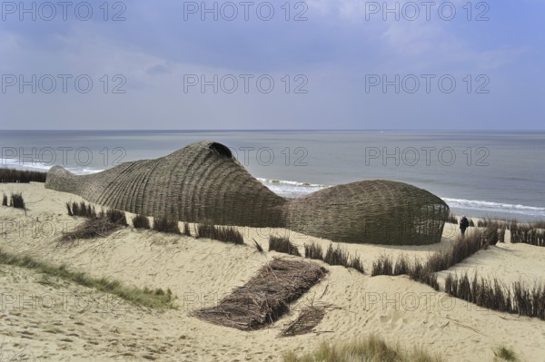 Sandworm by artist Marco Casagrande in the dunes during Beaufort04 at De Haan, Wenduine, Belgium, Europe