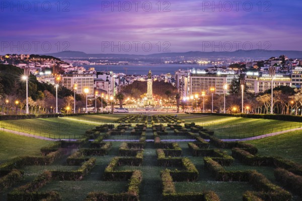 View of Lisbon Marquis of Pombal Square seen from the Eduardo VII Park in the evening twilight. Lisbon, Portugal, Europe