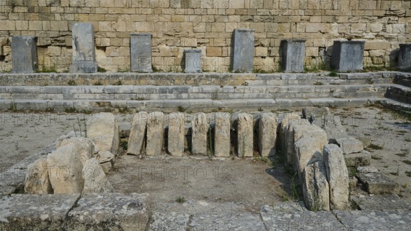 Several upright stones in an ancient archaeological excavation, ancient well house, Kamiros, Archaeological site, Ancient city, Foundation of Doric Greeks, Rhodes, Dodecanese, Greek Islands, Greece, Europe