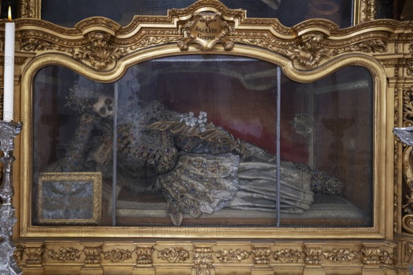 Magnificent glass shrine with decorated bones of a catacomb saint, Basilica of St Mauritius, Niederaltaich, Lower Bavaria, Germany, Europe