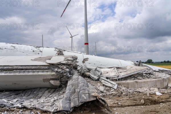 Demolished tower of a 20 year old wind turbine, in the Werl wind farm, 5 old Enercon E-66 turbines are demolished, 2 new Siemens SG6.6-170 wind turbines replace them, the 2 new wind turbines produce twice as much energy, 12 MW power, as the 5 old wind turbines, called repowering, demolition work, Werl, North Rhine-Westphalia, Germany, Europe
