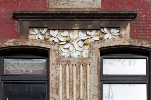 Facade decoration on a Wilhelminian style house for renovation, branches with pears, detail, Duisburg-Neuenkamp, North Rhine-Westphalia, Germany, Europe