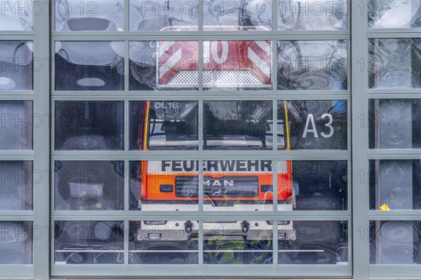 Fire brigade, fire station, modern fire station, glass Tor tor, emergency vehicles in the vehicle hall, Cologne, North Rhine-Westphalia, Germany, Europe