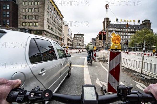 Cycling in the city, city centre road, roadworks, narrowed lanes, cyclists' perspective, Essen, North Rhine-Westphalia, Germany, Europe