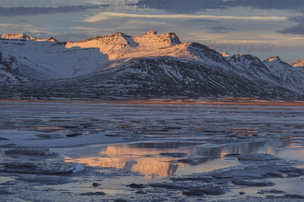 Morning light on Bergen on the coast, icy fjord, Breiddalsvik, East Fjords, Iceland, Europe