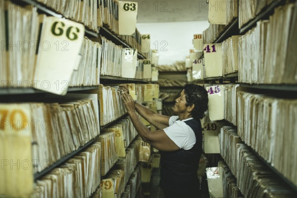 Administrative assistant in the archives of a psychiatric clinic, Lidice district, Caracas, Venezuela, South America