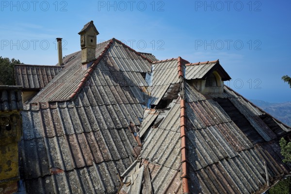 Dilapidated roofs of an old building with red tiles and a chimney under a clear blue sky, Mussolini Villa, Villa de Vecchi, Profitis Ilias, Empona, Rhodes, Dodecanese, Greek Islands, Greece, Europe