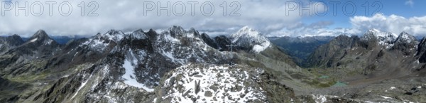 Panorama, mountaineer at the summit Keeskopf with summit cross, mountain landscape with snow, aerial view, view into Gradental and Debantal, Schober group, Hohe Tauern National Park, Eastern Alps, Carinthia, Austria, Europe