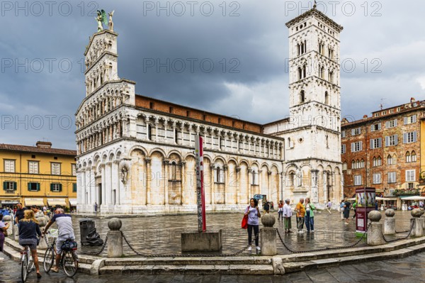 Rain clouds over the church and Piazza San Michele, historic city centre, Lucca, Tuscany, Italy, Europe
