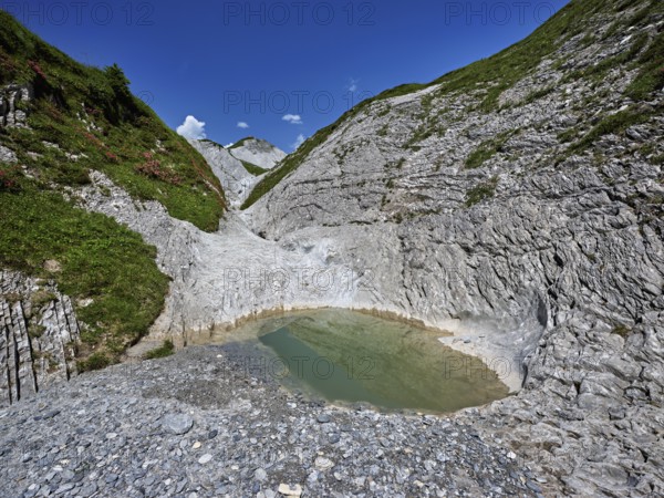 Glacier mill with glacier pots on the Trinser Alp Mora, Trin, Canton Graubünden, Switzerland, Europe
