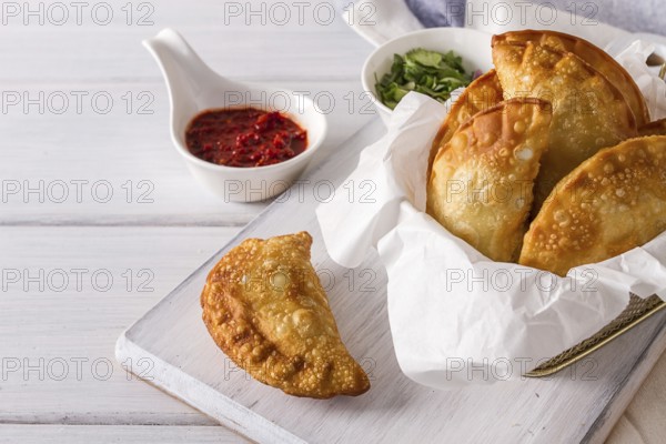 Fried chebureks, close-up, on a white background, no people