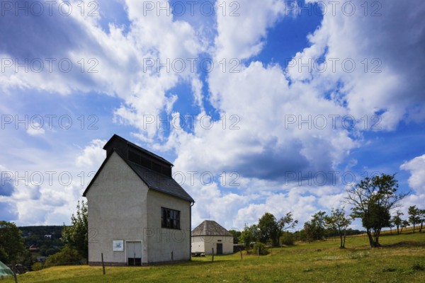 Gunpowder house: The gunpowder house is located not far from the Überhauen 20 ventilation shaft. Although the use of gunpowder for drilling and blasting in Altenberg has been documented since 1668, this extraction method was slow to catch on due to the high costs involved. In 1793, the massive powder house was built at a sufficiently safe distance from the town centre. It was used for the safe storage of gunpowder until the second half of the 19th century. Ventilation shafts: The two ventilation shafts Überhauen 20 (from 1966) and Überhauen 32 (from 1974), which were protected by shaft buildings, were used for ventilation in the last period of mining in Altenberg. They supplied the mine with fresh air and removed pollutants such as rock dust, blasting gases and ionising radiation caused by radon and radon by-products. The two buildings are among the few remaining ventilation shaft buildings in the Ore Mountains, Altenberg, Altenberg, Saxony, Germany, Europe