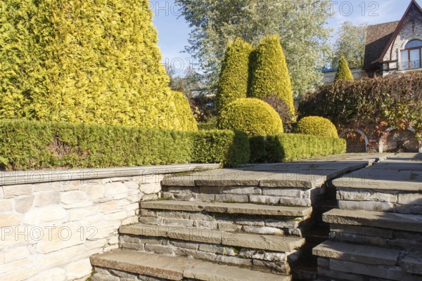 Cottage garden with stone stairs and retaining wall, Modern landscape design