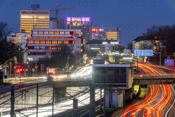 The skyline of Essen city centre, A40 motorway, Ruhr Expressway, North Rhine-Westphalia, Germany, light rail, underground, Hobeisenbrücke stop, Europe